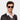 A man wearing Juta Earth sunglasses by TBD Eyewear – sustainable bio-acetate frame in Bottle Green, made in Italy