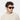 man wearing sunglasses lino eco havana bottle green made in Italy with sustainable materials
