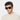 man wearing sunglasses lino eco havana bottle green handcrafted in Italy with sustainable materials
