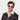 Front view of a man wearing Donegal White sunglasses with grey lenses by TBD Eyewear made from sustainable materials