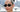 Close-up of Zoë Kravitz wearing black oval-shaped sunglasses