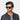 Man wearing Mastro Eco Black sunglasses by TBD Eyewear – featuring a sustainable frame and Bottle Green lenses made in Italy