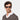 A man wearing sustainable Oxford sunglasses by TBD Eyewear in Eco Havana Blue – crafted from bio-acetate and made in Italy