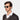 Man wearing Cran sunglasses in Eco Transparent Bottle Green bio-acetate frame sustainably handcrafted in Italy TBD Eyewear