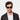 Man wearing Cran sunglasses by TBD Eyewear in Eco Black Gradient Grey sustainable bio-acetate handcrafted in Italy