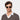 Man wearing Lapel sunglasses by TBD Eyewear in Transparent Gradient Grey – made from bio-acetate and handcrafted in Italy