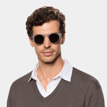 Man wearing Lapel sunglasses by TBD Eyewear in Transparent Gradient Grey – made from bio-acetate and handcrafted in Italy