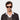 Man wearing TBD Eyewear's Denim Eco sunglasses handcrafted in Italy with a sustainable Havana bio-acetate and Bottle Green lenses