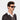 Man wearing TBD Eyewear's Denim Eco sunglasses made in Italy with a sustainable Havana bio-acetate and Bottle Green lenses