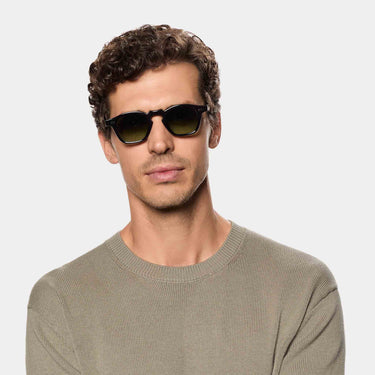 Man wearing sunglasses cord limited edition green glasses 10years handcrafted in Italy 