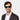 Man wearing Oak Black Green Sunglasses by TBD Eyewear blends classic design with modern character. Sustainably and handcrafted in Italy.
