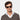 Man wearing sunglasses welt limited edition green glasses 10years made in Italy Sustainable materials Tbd Eyewear