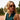 A woman styled in Welt Honey sunglasses in low-impact, featuring bottle green lenses by Tbd Eyewear