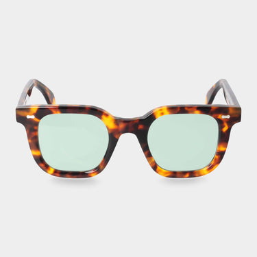 Front view of the Mastro Eco Spotted Havana sunglasses by TBD Eyewear, fully sustainable, handmade in Italy with light green lenses
