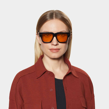 woman wearing sunglasses tela eco black orange made in Italy by tbd eyewear